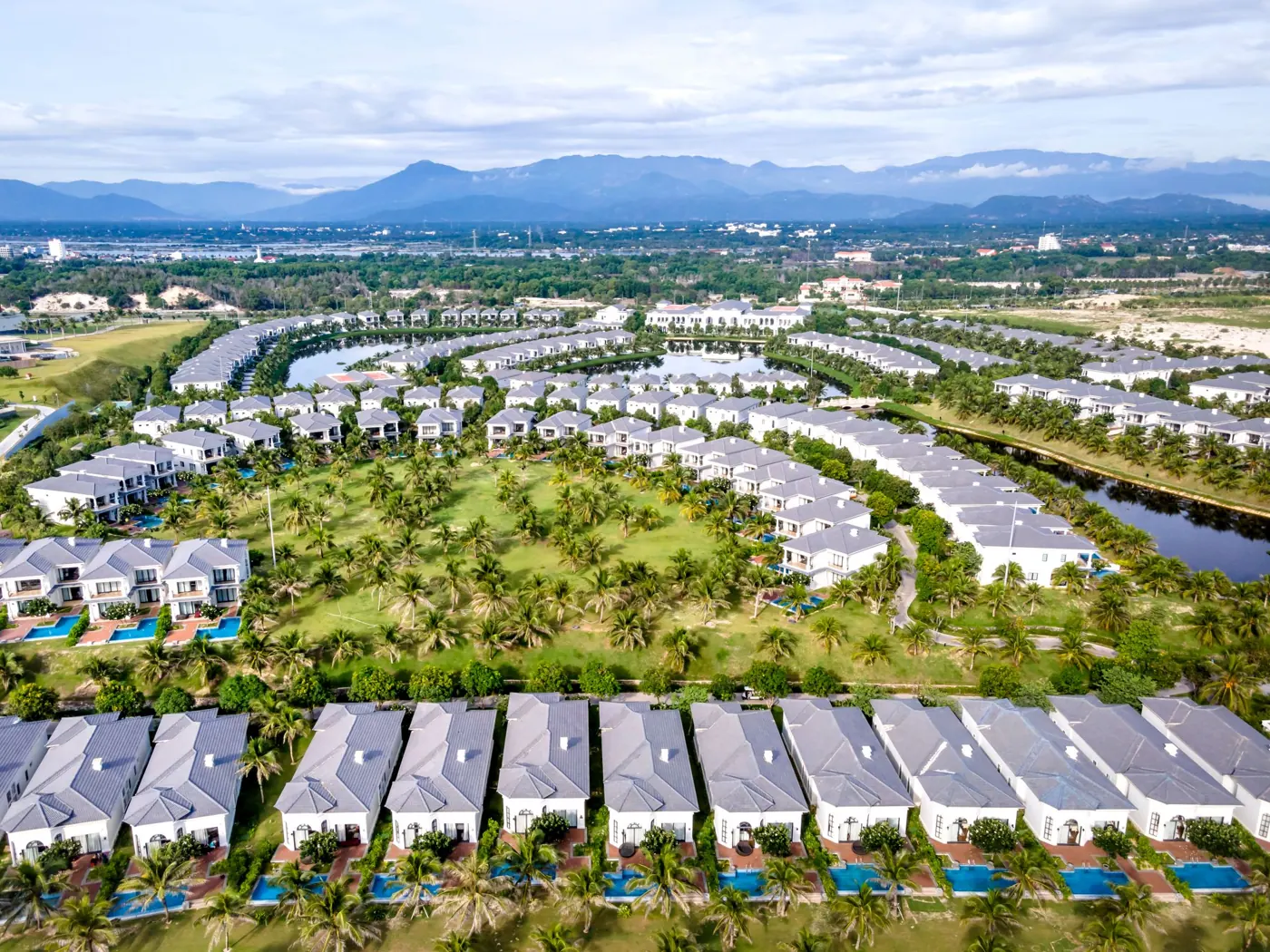 Paired villas around a green park, seen from above