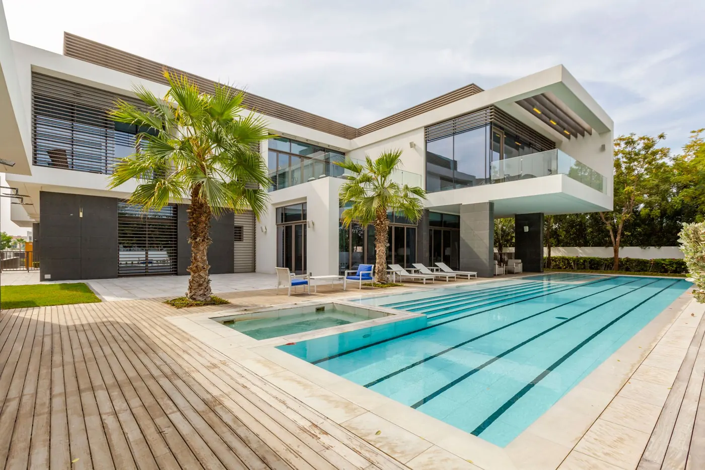 A modern villa with a private pool and palms